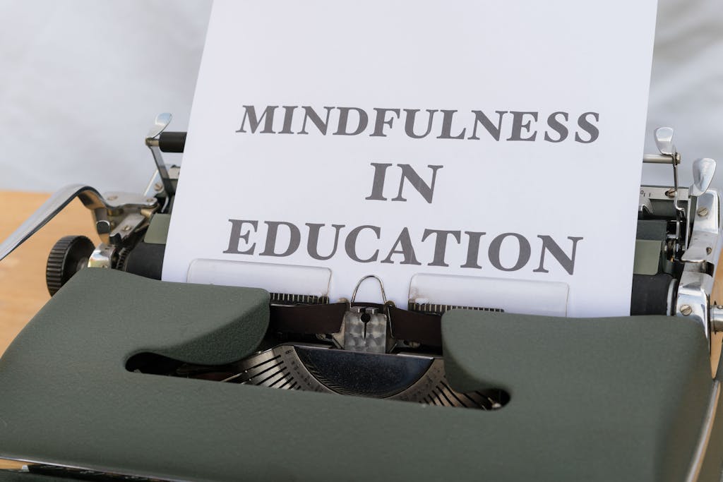 Close-up of a typewriter with paper showing 'Mindfulness in Education'.