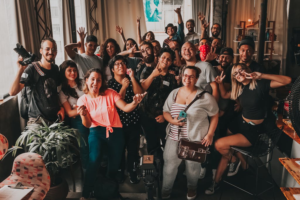 Diverse group enjoying a cheerful meeting indoors in São Paulo, capturing unity and joy.